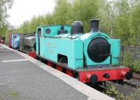 Preserved industrial locomotives alongside the platform on the north side of the Summerlee Museum site in May 2005. Nearest the camera is Hudswell Clarke  0-6-0T 895/1909, followed by Gibb & Hogg 0-4-0ST 16/1898, Sentinel 4wVB 9628/1957 and  Barclay 0-4-0DH 472/1961. The North Clyde Line runs past on the other side of the tree-lined fence.<br><br>[John Furnevel 09/05/2005]