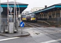 A Portrush shuttle service meets a Belfast - Londonderry train at Coleraine station on 6 March 2018.<br><br>[Andy Furnevel 06/03/2018]