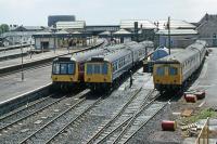 The first generation DMU stabling area adjacent to Platform 1 at Stirling in June 1989. The veteran units present – two Class 107 and a Swindon-MetCam hybrid – were close to the end of their working lives. The area later became a car park. Probably the last regular passenger service to use Platform 1 was the 17.58 Stirling to Bridge of Allan and Dunblane. This ran 1985-1986 as a connecting service for the newly re-opened Bridge of Allan station. <br><br>[Mark Dufton /06/1989]