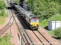 A loaded coal train from Ravenstruther enters the north end of Millerhill Yard on 17 June 2005 behind EWS 66048. The coal is destined for Drax power station, North Yorkshire.<br><br>[John Furnevel 17/06/2005]