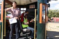 <I>Welcome aboard!</I> The friendly crew of the Franschhoek Wine Tram running between the local South African vineyards near Cape Town.<br>
<br><br>[Peter Todd 23/02/2018]