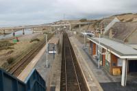 Looking north from the footbridge at Sellafield on 8th March 2018, showing the unusual layout of the platforms. The island platform has a wire mesh fence as it only serves trains on the left hand (northbound) track. Heavily used by workers at the nearby plant the station had over 200,000 recorded passengers in 2016/17, a similar number to that handled by Whitehaven. <br><br>[Mark Bartlett 09/03/2018]