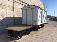 This covered goods van was restored in 2015 as a reminder of the once extensive Gibraltar Dockyard Railway. At its height the sidings, storage areas and tunnels inside the rock were served by seventeen locomotives but these two small railway vehicles, displayed by the Ragged Staff Gate in the defensive walls, are one of the few tangible remnants of those days. <br>
<br>
<br><br>[Martin MacGuire 15/02/2018]