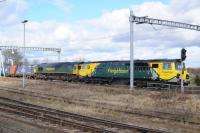 Great Western line photographers are having to get used to working around electrification masts and gantries now. 70011 & 66570 are seen on an eastbound Freightliner from Leeds bound for Southampton. 8th March 2018.<br>
<br>
<br><br>[Peter Todd 08/03/2018]