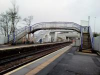 Last chance to see? The fine lattice footbridge at West Calder hangs on as its hulking replacement nears completion. The whole Shotts line is to be closed for 10 days over Easter, and I'm wondering if that's when the bridge will be removed. OHLE masts currently stop short of the station either side - more work for Easter?<br><br>[David Panton 13/03/2018]