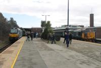 Enthusiasts swarm over the platforms at Barrow on 13th March 2018 during the few minutes when the two loco hauled trains are both in the station together. 37402, newly arrived from Preston will head for the carriage sidings for a layover of approximately three hours before continuing north. 68017 on the left will shortly depart for Carlisle on the 1140 service on the second day of Class 68 operations.      <br><br>[Mark Bartlett 13/03/2018]