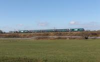 The morning Carlisle to Preston service crosses the embankment at Bay Horse on 19th March 2018 behind 68018 <I>Vigilant</I> with 68017 <I>Hornet</I> bringing up the rear. The Class 68s seem to be rostered for this train Monday, Wednesday and Friday with a Class 37 operating on Tuesday and Thursday. <br><br>[Mark Bartlett 19/03/2018]