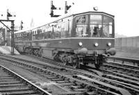 The BMU departing Aberdeen on the first day of public service (21st April 1958). The battery compartments are clearly visible under both vehicles. Note also the destination boards and brackets visible on the side of the leading coach above the windows; although a common feature on main-line coaches at the time this was an unusual feature on a multiple unit train.<br><br>[David Murray-Smith 21/04/1958]