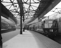 Metropolitan-Cammmell Class 100 DMU at Platform 1 in Aberdeen station on the first day of diesel services to Ballater (7th July 1958). The battery charging equipment for the BMU was located just beyond the buffer stops on this platform.<br><br>[David Murray-Smith 07/07/1958]