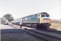 Station scene at Dufftown in 1984. Mk2, non-sleeping Sleeper services stock from Aberdeen was used for the Northern Belle and distillery tours using a Class 47 also lying over between sleeper duties.  I recall the 47 had a vinyl sticker on it, as seen here but can't remember the details. Perhaps other Railscot visitors will know?<br>
<br>
<br><br>[Crinan Dunbar //1984]