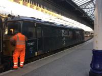 73967 is detached from the sleeper train as it arrives in Aberdeen on 20th March 2018. 967 then ran round the carriages and made use of the wash before stabling them for the day.<br><br>[Caleb Abbott 20/03/2018]