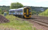 ScotRail 158782 drops down from Larbert Junction towards Carmuirs East on 20 May 2015 with a Dunblane - Edinburgh service. Over on the right is the route to Carmuirs West, also on a falling gradient in order to pass below the Forth and Clyde Canal, above which stands the Falkirk Wheel in the right background.<br><br>[John Furnevel 20/05/2015]