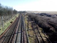 The first steps in construction of the brownfield new town of Blindwells appear to be under way. The start of the long-severed NCB branch can be seen. A stranded MAS signal (once clearly visible from the ECML) survives among the vegetation round about where the distant orange jackets are in middle of the picture. I had meant to get a closer look, but I've left it too late as the site is now fenced off!<br><br>[David Panton 29/03/2018]