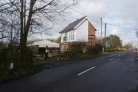 The former signalbox at French Drove on the north side of the road, the station was on the south side (right). The structure appears to have been converted into domestic use and the windows in this end have been boarded over in this view on 20 February 2018.<br><br>[John McIntyre 20/02/2018]