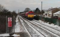 66137 approaching Rhoose on a Hope (Earles Sidings) Dbs to Cwmbargoed Opencast Colliery empties.<br><br>[Alastair McLellan 20/03/2018]