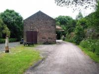 View south at High Peak Junction in June 2002, with the Cromford Canal on the left alongside the former transit shed. [See image 63272]<br><br>[Ian Dinmore 22/06/2002]