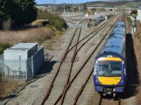 170406 passes Raiths Farm yard with the 12.00 from Aberdeen to Inverness.  The rusty rails would indicate no traffic into the yard for months. Update: a trainload of sleepers arrived on 4 April.<br><br>[Bill Roberton 24/03/2018]