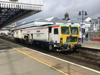 SB Rail Unimat 08-4x4/4S-RT Tamper passes Stirling platform 3 at speed on its way to Carstairs on 23rd March 2018.<br><br>[Colin McDonald 23/03/2018]