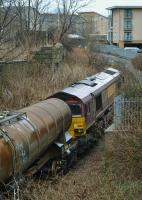 Looking north from the Beach Boulevard bridge as 66168 shunts china clay tanks into Waterloo Yard.<br><br>[Bill Roberton 23/03/2018]