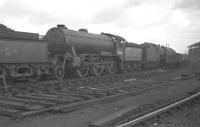 Locomotives stabled over the weekend in the shed yard at Heaton (52B) on an overcast Sunday 26 March 1961. The coaling stage is visible in the right background. The lineup includes Gresley K3 2-6-0 no 61854, a visitor from Tweedmouth (52D).<br><br>[K A Gray 26/03/1961]