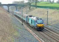 68017 <I>Hornet</I> brings up the rear of 2C32 Carlisle to Preston passing under Hampson Lane bridge at Galgate on 11th April 2018. On this occasion the train was headed by 68004 <I>Rapid</I>. The daily trip to Preston will cease with the May timetable change when Class 158 Sprinters are being introduced on Barrow trains. Loco hauled will then be confined to the Barrow to Carlisle line. <br><br>[Mark Bartlett 11/04/2018]