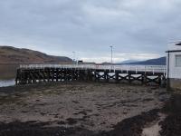 Tighnabruaich Pier, looking down the Kyle of Bute, on the evening of 31st March 2018. Unfortunately the <I>PS Waverley</I> wasn't  present on this occasion [See image 52410] but the Arran mountains can be seen in the distance. <br><br>[Mark Bartlett 31/03/2018]