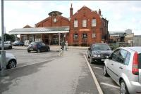 The car park at Bridlington, looking south west towards the main station entrance on 1 October 2008. This area was once part of the goods yard, accessed via the gate on the right [see image 42743]. Beyond the gate are through platforms 4&5, used by trains on the Yorkshire Coast line between Scarborough and Hull. The other operational platform nowadays is south facing bay platform 6, normally used by a shuttle service between Bridlington and Hull.  <br><br>[John Furnevel 01/10/2008]