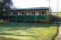 A short distance from the former station site at Wisbech St Mary (now cleared and redeveloped for housing) were two GER carriages in the grounds of a house. The carriage featured had 4 compartments and has been beautifully converted into a holiday home. When the present owner had purchased the site he found the carriage in a derelict state and covered with brambles. Following restoration the property is now available to rent  as Ivywood Carriage; further details are at www.fenlandselfcateringholidays.com <br><br>[John McIntyre 25/02/2018]