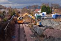 In 2014, the Stirling to Longannet line was re-laid after only 6 years of use. The original metal sleepers were replaced by concrete versions and the track bed brought up to a higher standard in view of the continuing wear and tear from the heavy coal trains to Longannet power station. At the time, the investment was predicated on the power station remaining in operation until at least 2025, but shortly after the upgrade had been completed, closure was brought forward to March 2016. This photo shows the upgrading work in progress in Clackmannan on 1st March 2014.<br><br>[Mark Dufton 01/03/2014]