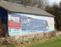 <I>Banksy woz here...</I> or perhaps not...  Rear of the platform shelter at the former Marishes Road station, North Yorkshire, on the line between Malton and Pickering. Photographed on 26 March 2010, some 45 years after closure. The faded painting depicts 4468 <I>Mallard</I> carrying the headboard of <I>'The Scarborough Flyer'</I>. For the front view [see image 29018]. <br><br>[John Furnevel 26/03/2010]