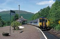 The Class 156 DMUs were originally built as two car units, but from time to time, operators have assembled them into three car units to suit passenger loadings. One such occasion was the summer of 1989 on the West Highland line. This photo shows a three car 156 assemblage at Tyndrum Upper in June 1989.<br><br>[Mark Dufton /06/1989]