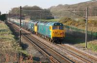 <I>The Cumbrian Hoovers</I> tour made a fine sight heading back home at Woodacre after traversing the Cumbrian Coast line on 14th April 2018. 50007 and 50049 had a full rake of blue and grey stock on this fully booked train. <br><br>[Mark Bartlett 14/04/2018]