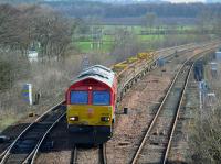 DBC 66230 passes Inverkeithing East Junction, bound for Millerhill, with a short train of track panels recovered from between Perth and Dundee. 8 April 2018.<br>
<br>
<br><br>[Bill Roberton 08/04/2018]