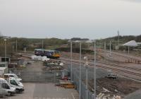 In the new railway age it seems that every set of points is a junction. A Pacer bound for Blackpool South on 16th April 2018 slows on the new down line waiting for a train to come off the single track branch at the new Kirkham West Junction. [See image 62623] for the same location just three months earlier. New raised parapets on the bridge now prevent a direct comparison.<br><br>[Mark Bartlett 16/04/2018]