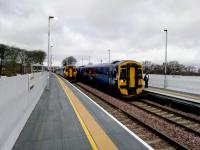 A stopping service for Edinburgh (right) passes a semi-fast for Glasgow at the newly reconstructed, longer platformed Livi South. The new station is clearly a work in progress and has a rather temporary look. Mind you, the previous station still looked temporary after 30+ years. The new was built during a 10 day line closure so let's be generous.<br><br>[David Panton 16/04/2018]