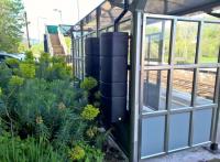 <h4><a href='/locations/F/Freshford'>Freshford</a></h4><p><small><a href='/companies/B/Bradford_Line_Frome,_Yeovil_and_Weymouth_Railway'>Bradford Line (Frome, Yeovil and Weymouth Railway)</a></small></p><p>If I told you there were two water tanks at Freshford, you probably wouldn't believe me. But here they are on the back wall of the passenger shelter on platform 1, harvesting rainwater to water the gardens. Probably not big enough (or clean enough water) to help out with passing steam engines. [Ref query 18 July 2018] 91/122</p><p>05/05/2018<br><small><a href='/contributors/Ken_Strachan'>Ken Strachan</a></small></p>