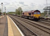 A long freight comes off the Coventry line at Leamington, having just passed through Kenilworth station on its opening day [see image 63849]. The building on the right appears to be occupied by a skeleton staff.<br><br>[Ken Strachan 30/04/2018]