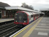 <h4><a href='/locations/F/Fairlop'>Fairlop</a></h4><p><small><a href='/companies/F/Fairlop_Loop_Great_Eastern_Railway'>Fairlop Loop (Great Eastern Railway)</a></small></p><p>LUL 1992 stock no. 91105 with a Central Line service to Woodford via Hainault arriving at Fairlop station in Essex, on 5th January 2013. This station was opened by the GER in 1903 and was first served by tube trains in 1948. 3/30</p><p>05/01/2013<br><small><a href='/contributors/David_Bosher'>David Bosher</a></small></p>