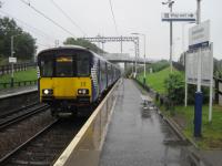 <h4><a href='/locations/G/Greenfaulds'>Greenfaulds</a></h4><p><small><a href='/companies/C/Caledonian_Railway'>Caledonian Railway</a></small></p><p>318270 arriving at Greenfaulds station from Cumbernauld in pouring rain on 26th July 2017. 4/4</p><p>26/07/2017<br><small><a href='/contributors/David_Bosher'>David Bosher</a></small></p>