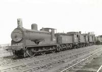 Locomotives stored in the shed yard at Polmadie in the spring of 1960 include ^Jumbo^ 0-6-0 57418, followed by 0-4-4Ts 55237 and 55223.