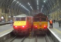 <h4><a href='/locations/K/Kings_Cross'>Kings Cross</a></h4><p><small><a href='/companies/G/Great_Northern_Railway'>Great Northern Railway</a></small></p><p>Another UK Railtours excursion bites the dust as 66002, with 67021 at the rear, comes to rest in the Cathedral of trains that is London King's Cross station, after returning from a visit to Locomotion at Shildon and the Weardale Railway to Stanhope, after dark on the evening of Saturday, 11th May 2019.   On the left is 82 207. 24/41</p><p>11/05/2019<br><small><a href='/contributors/David_Bosher'>David Bosher</a></small></p>