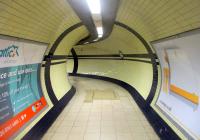 <h4><a href='/locations/M/Mornington_Crescent'>Mornington Crescent</a></h4><p><small><a href='/companies/C/Charing_Cross,_Euston_and_Hampstead_Railway'>Charing Cross, Euston and Hampstead Railway</a></small></p><p>Subterranean passageway from foot of lift shafts to platforms at Mornington Crescent station, LUL Northern Line, on 5th January 2019. 26/87</p><p>05/01/2019<br><small><a href='/contributors/David_Bosher'>David Bosher</a></small></p>