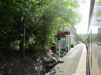 <h4><a href='/locations/B/Builth_Road'>Builth Road</a></h4><p><small><a href='/companies/C/Central_Wales_Extension_Railway'>Central Wales Extension Railway</a></small></p><p>UK Railtours' excursion from London Paddington to Llandrindod Wells passing the surviving high level station at Builth Road, looking back south as the train heads north, on 2nd September 2017. 9/22</p><p>02/09/2017<br><small><a href='/contributors/David_Bosher'>David Bosher</a></small></p>