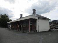 <h4><a href='/locations/L/Llandrindod_Wells'>Llandrindod Wells</a></h4><p><small><a href='/companies/C/Central_Wales_Railway'>Central Wales Railway</a></small></p><p>Exterior of Llandrindod Wells station, Heart of Wales Line, on 2nd September 2017.  This station opened in 1865 with the extension of the line from Knighton and was the temporary terminus until the line was further extended to Llandovery in 1868.  The current timetable sees only four trains a day in each direction between Shrewsbury, and Swansea with trains to the latter reversing at Llanelli, as they have had to do since the closure (under the hapless Beeching cuts) of the direct line from Pontardulais to Swansea Victoria in 1964.      18/22</p><p>02/09/2017<br><small><a href='/contributors/David_Bosher'>David Bosher</a></small></p>