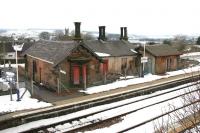 View west across the running lines at Sanquhar in the spring of 2006 showing the old station building on the down platform. Opened in 1850, the station was closed in 1965, only to reopen in 1994. (The boarded up building was subsequently restored and converted to holiday accommodation, thanks to Peter Rushton. [See image 5794])<br><br>[John Furnevel 14/03/2006]