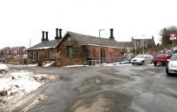 The road approach to Sanquhar station forecourt on a chilly March day in 2006. The date displayed on the shield above the window of the boarded up station building is 1850.<br><br>[John Furnevel 14/03/2006]