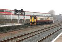 Passing a famous name. The 11.48 from Stranraer Harbour comes off the Troon line and into the platform 2 bay at Kilmarnock in March 2006. This train continues as the 13.50 Kilmarnock - Glasgow Central.<br><br>[John Furnevel 27/03/2006]