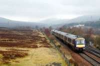 Northbound service passing Dalnacardoch.<br><br>[Ewan Crawford 10/03/2006]