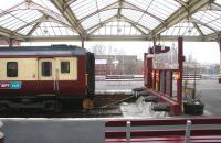 A train for Glasgow Central waits in the bay at Kilmarnock station on 27 March 2006.<br><br>[John Furnevel 27/03/2006]