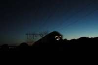 Last glimmer of light; the Fort William sleeper thunders east, east of Cardross.<br><br>[Ewan Crawford //]